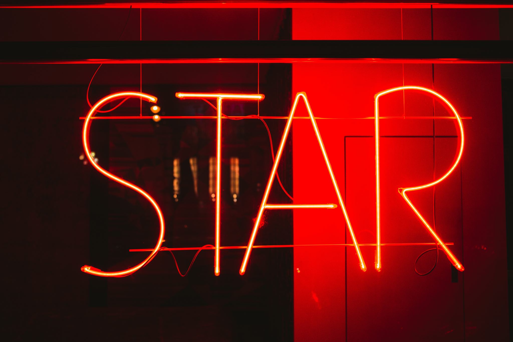 Neon sign showing STAR affirmation